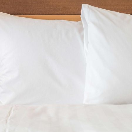 Holiday Inn Gurugram Sector 90 By Ihg Gurgaon Exterior photo Two pillows on a bed